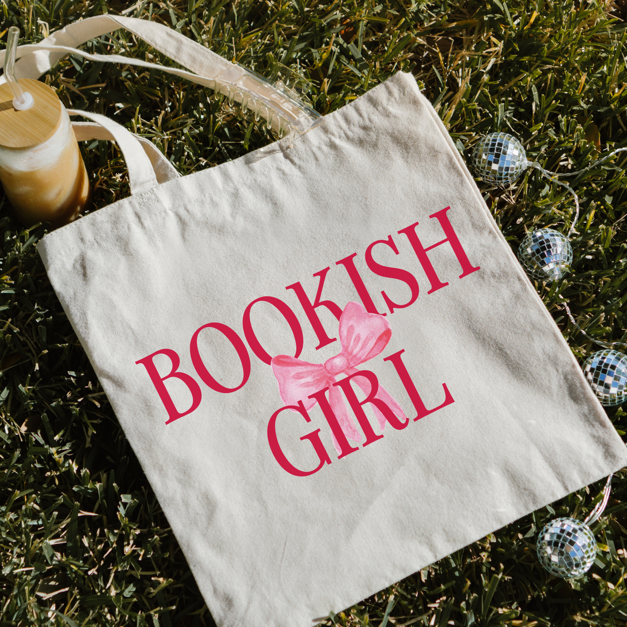 Tote bag with 'Bookish Girl' text on grass