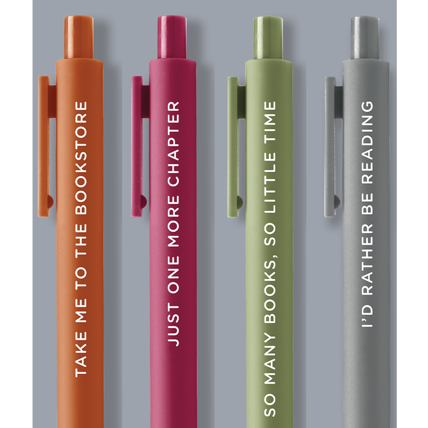 A pack of four multicolored gel pens with different phrases on the barrel, displayed in a packaging that calls them the 'Cozy Reader' set.