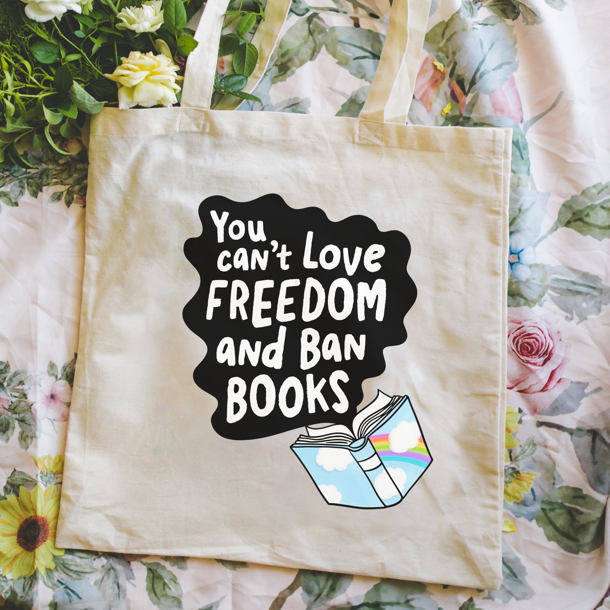 Tote bag with a quote about love, freedom, and books on a floral background