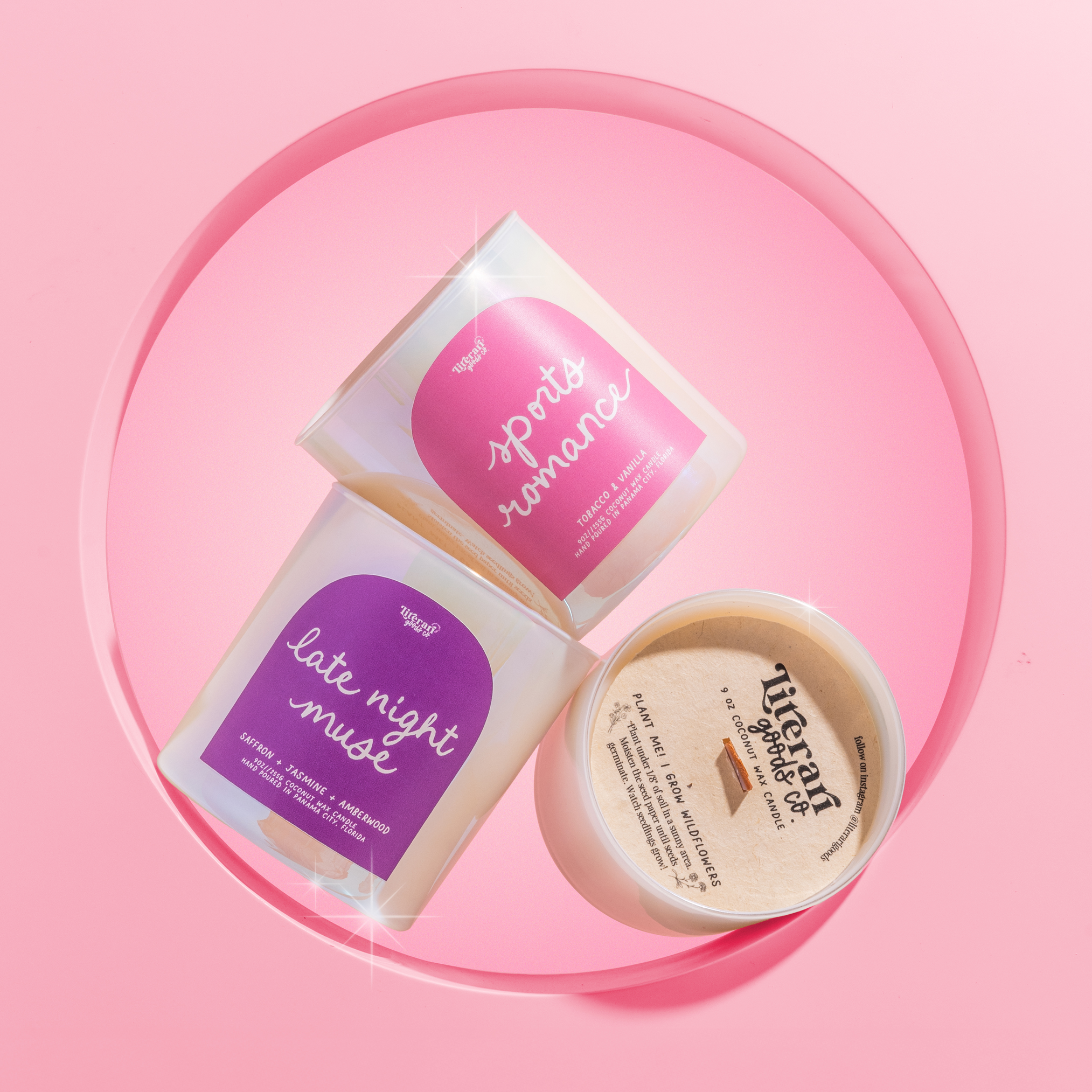 Three bookish candle gifts on a pink background