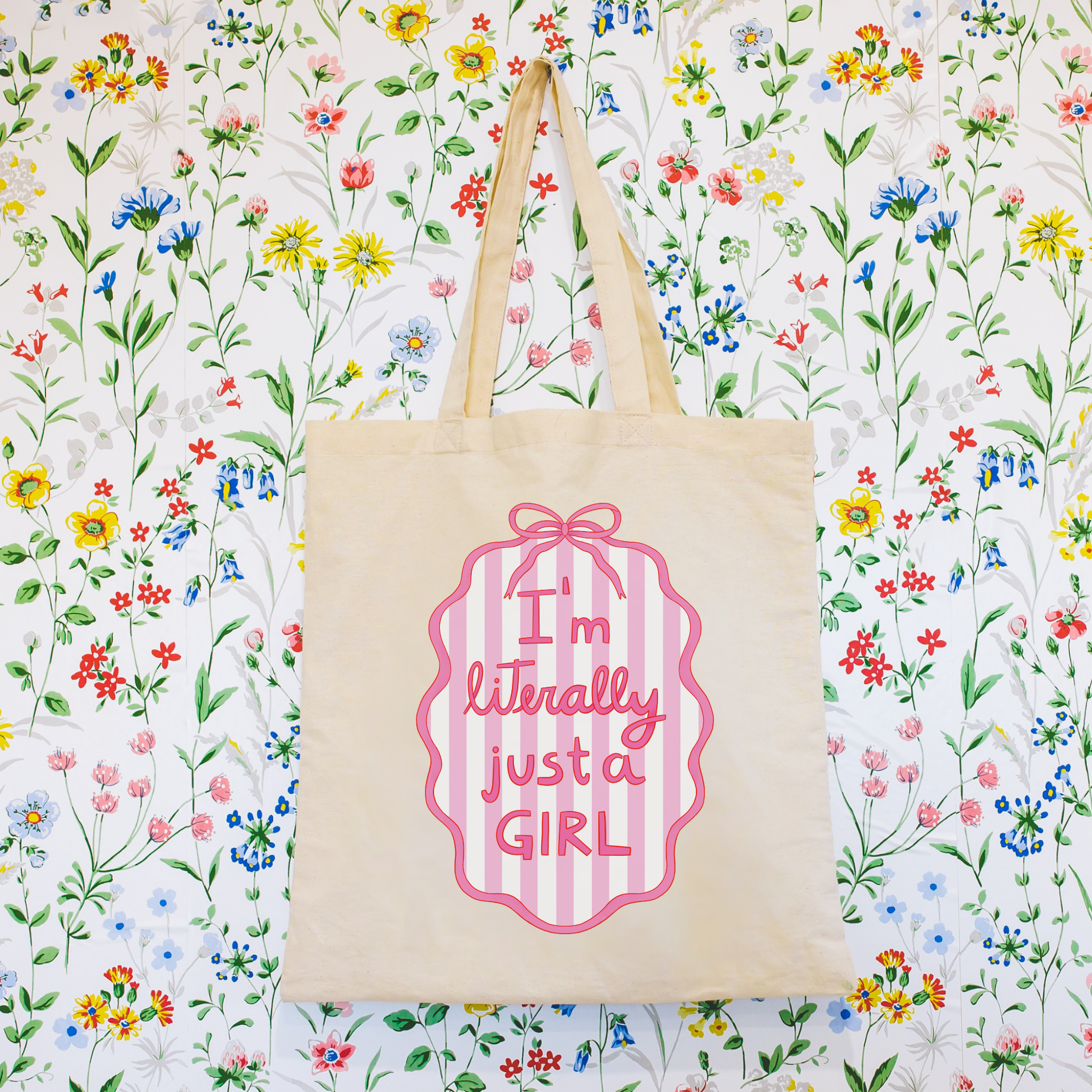 Tote bag with 'I'm literally just a girl' text on a floral background