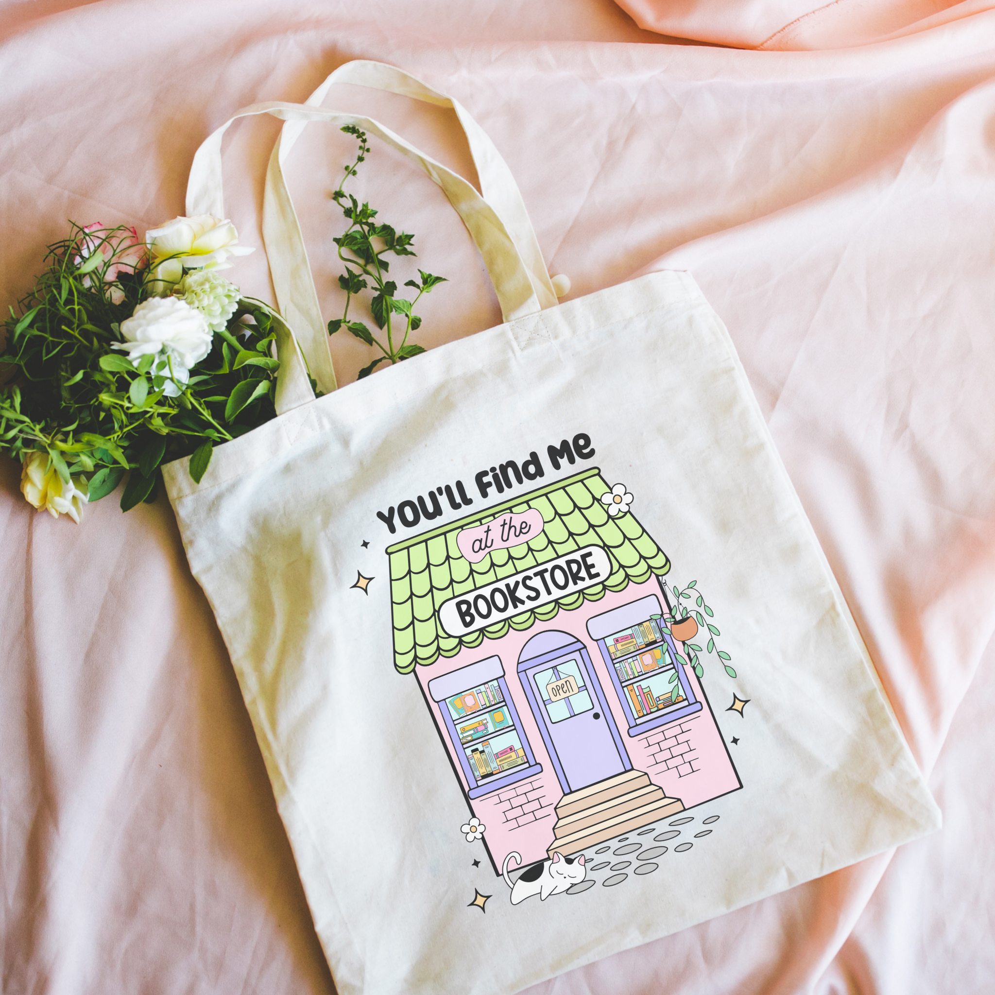 Bookish Tote bag with a bookstore illustration and text on a pink surface