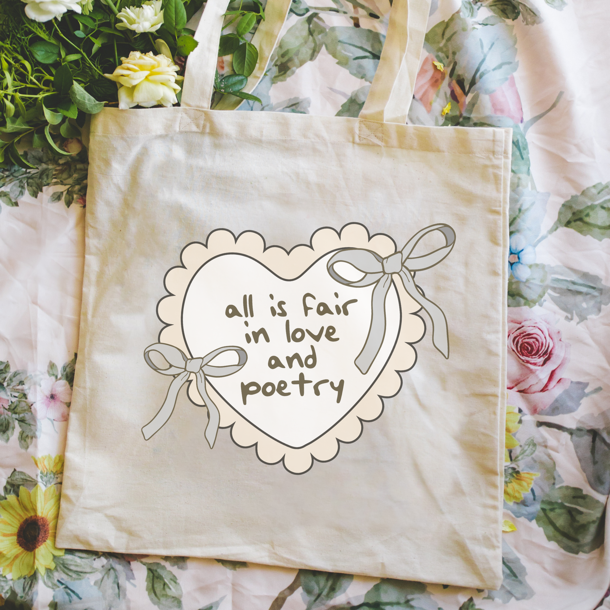 Bookish tote bag with heart design and text on a floral background