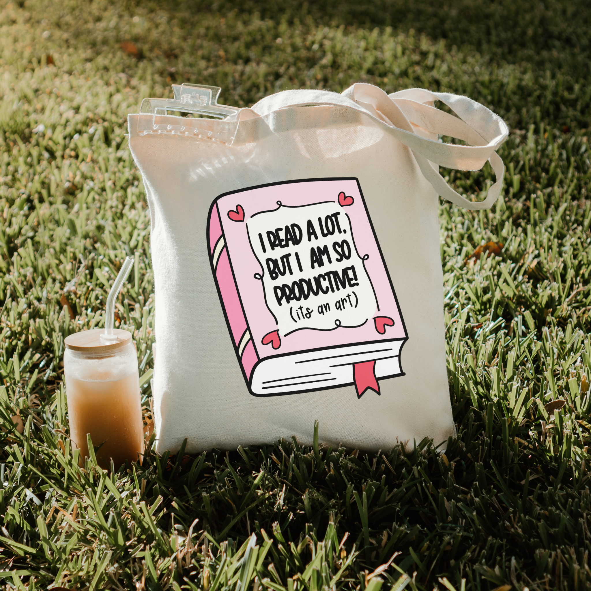 Bookish tote bag with a graphic design on grass