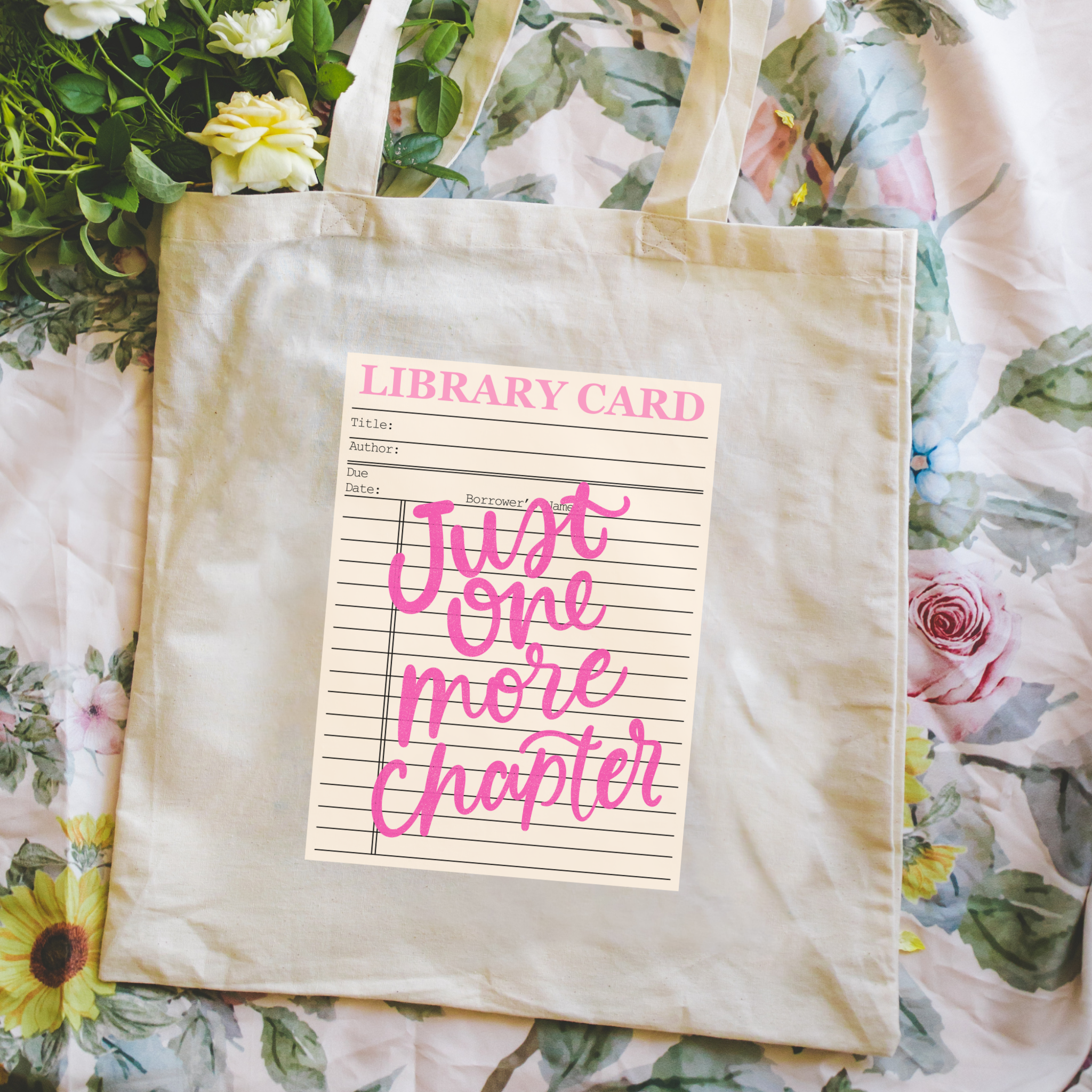 Bookish Tote bag with a 'Just One More Chapter' library card design on a floral background