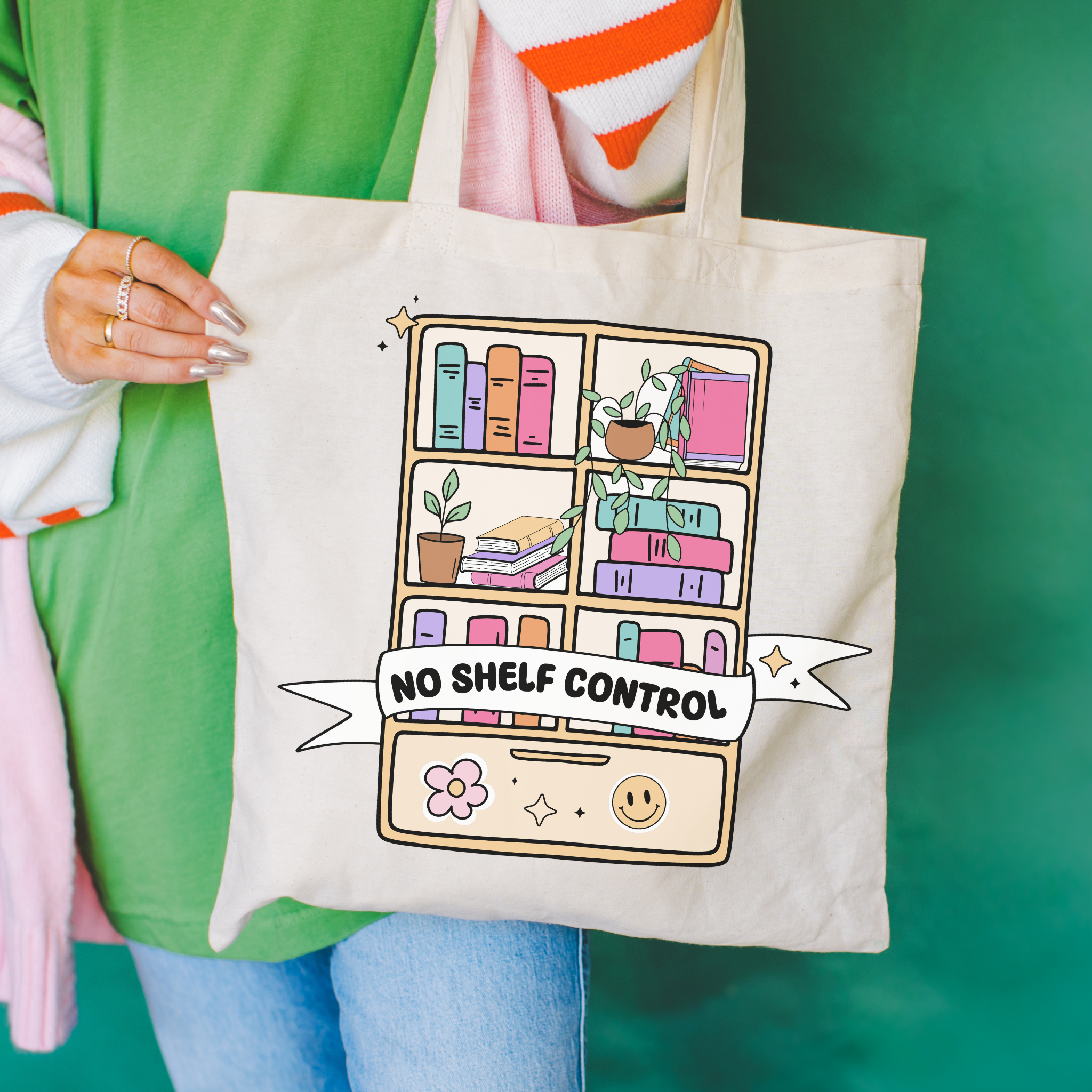 Tote bag with decorative design featuring a bookshelf and "no shelf Control"