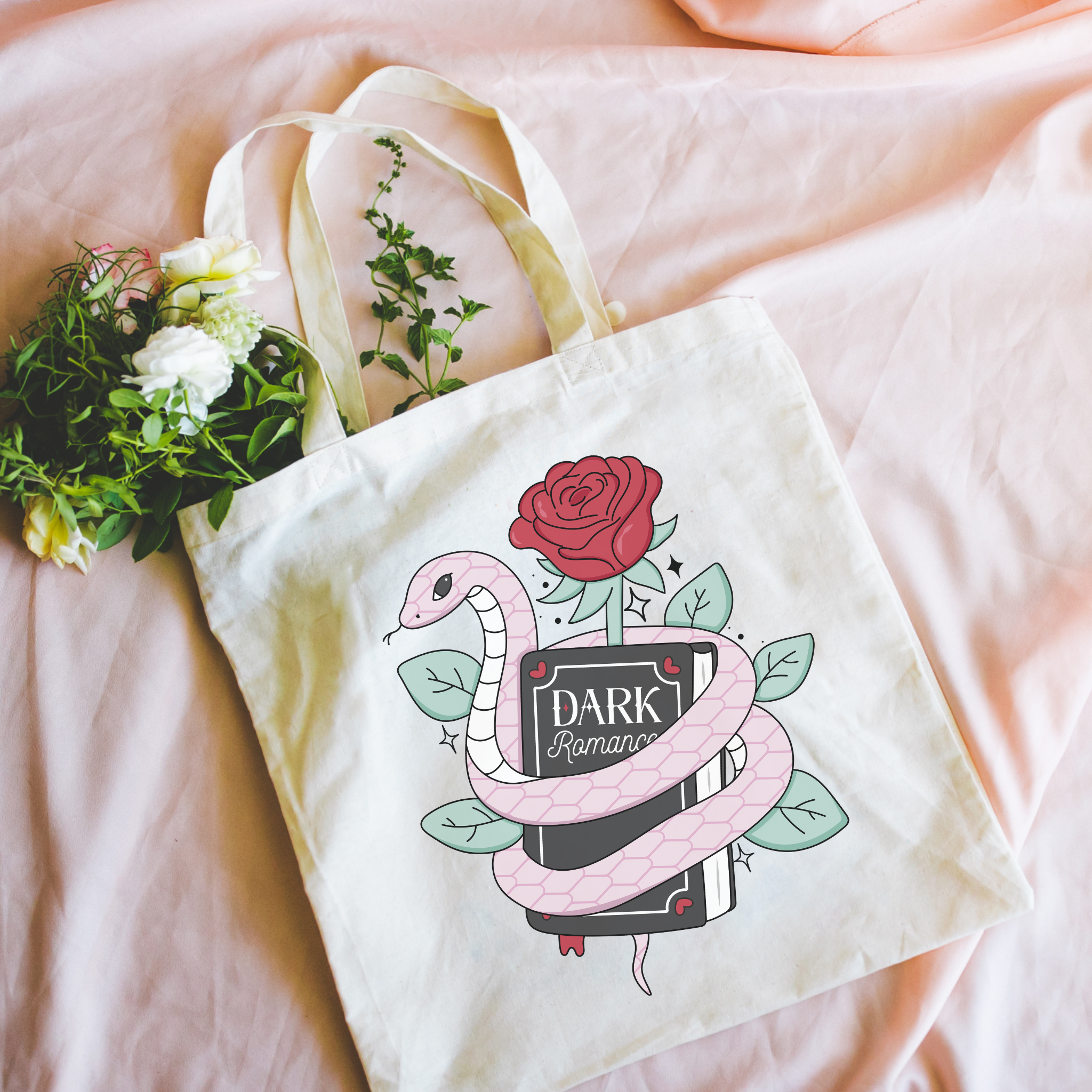 Dark Romance Tote bag with snake and book design on a pink surface