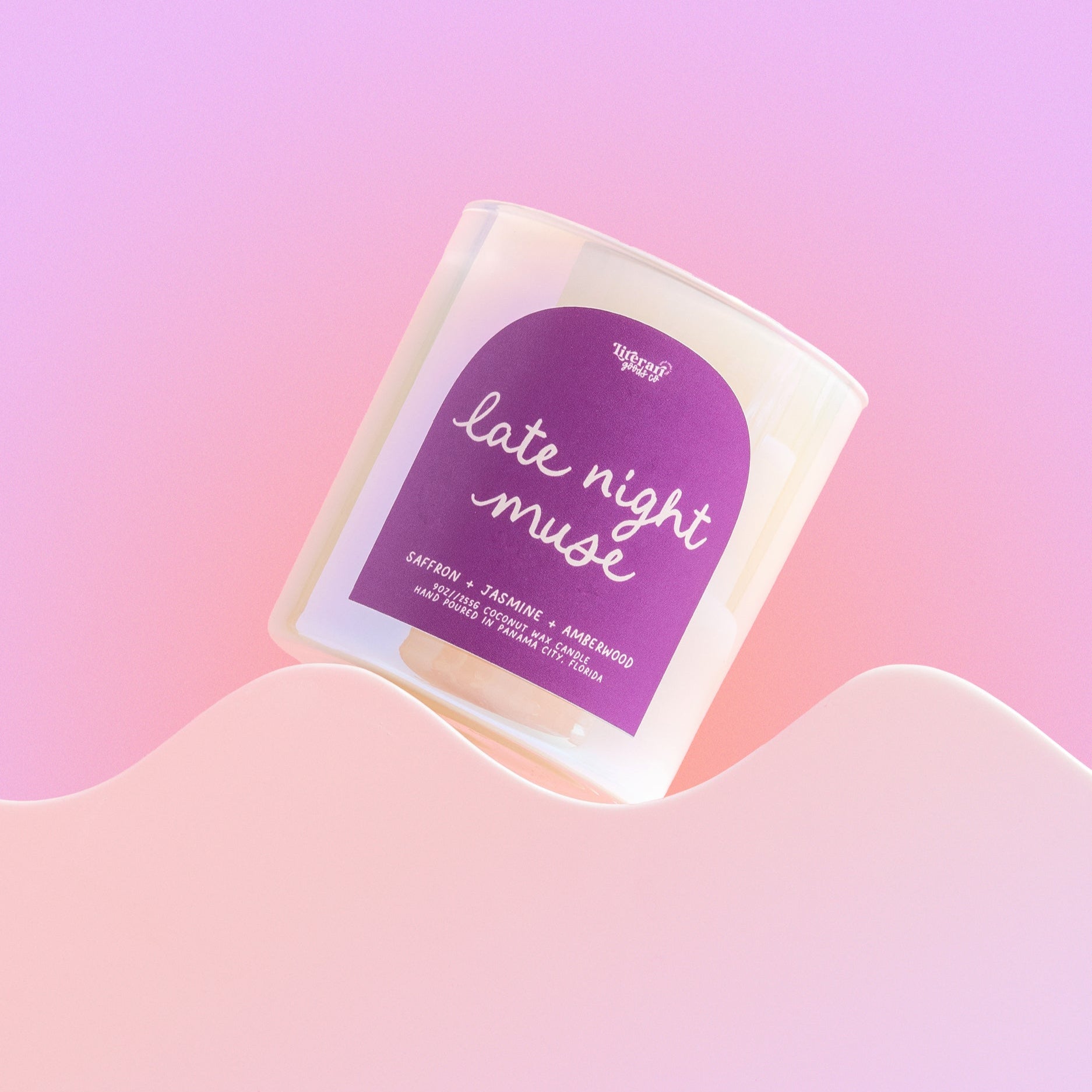 bookish candle Packaged product with 'late night muse' text on a gradient pink and purple background