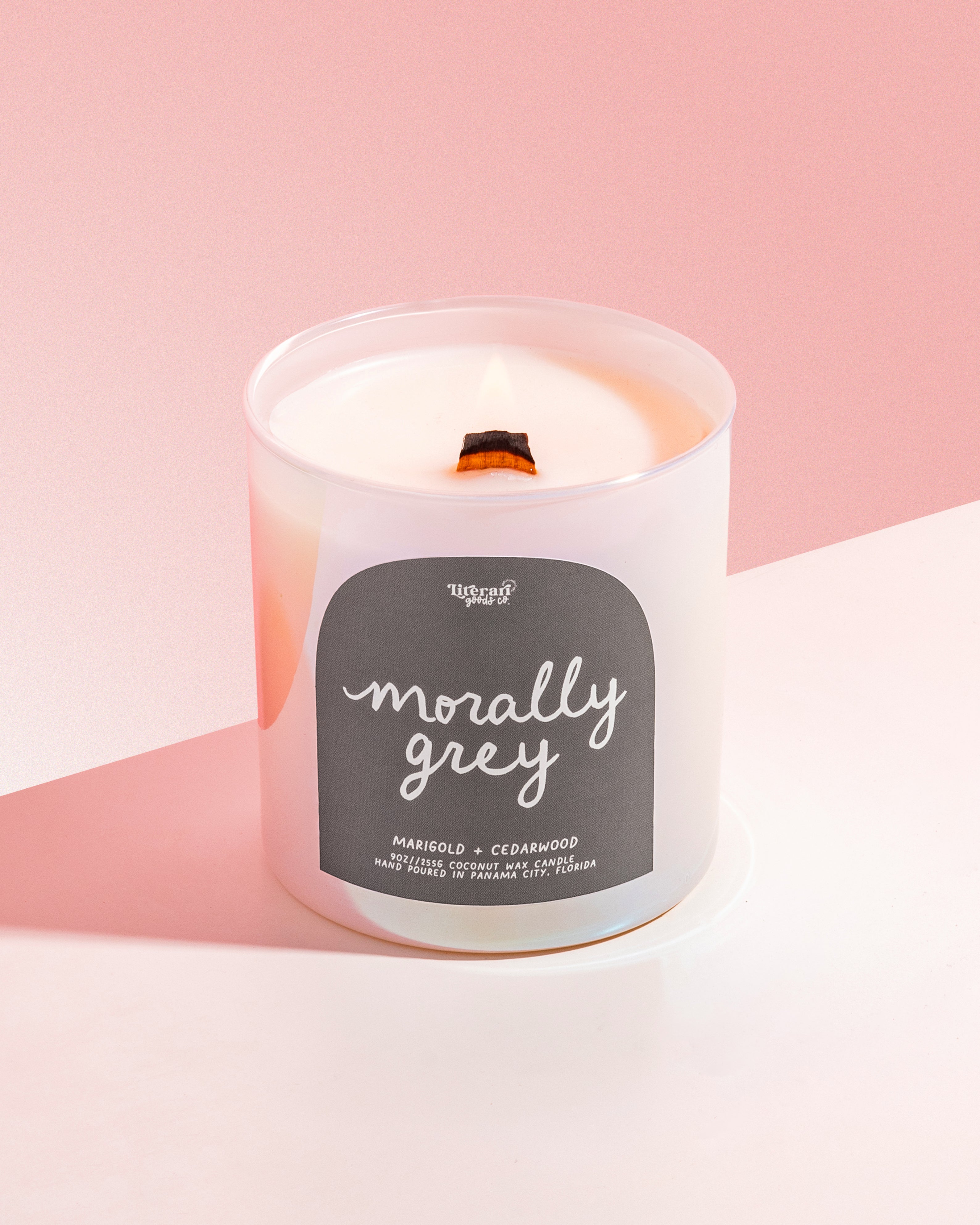 Book themed Candle with a label on a pink background, with label reading "morally grey"