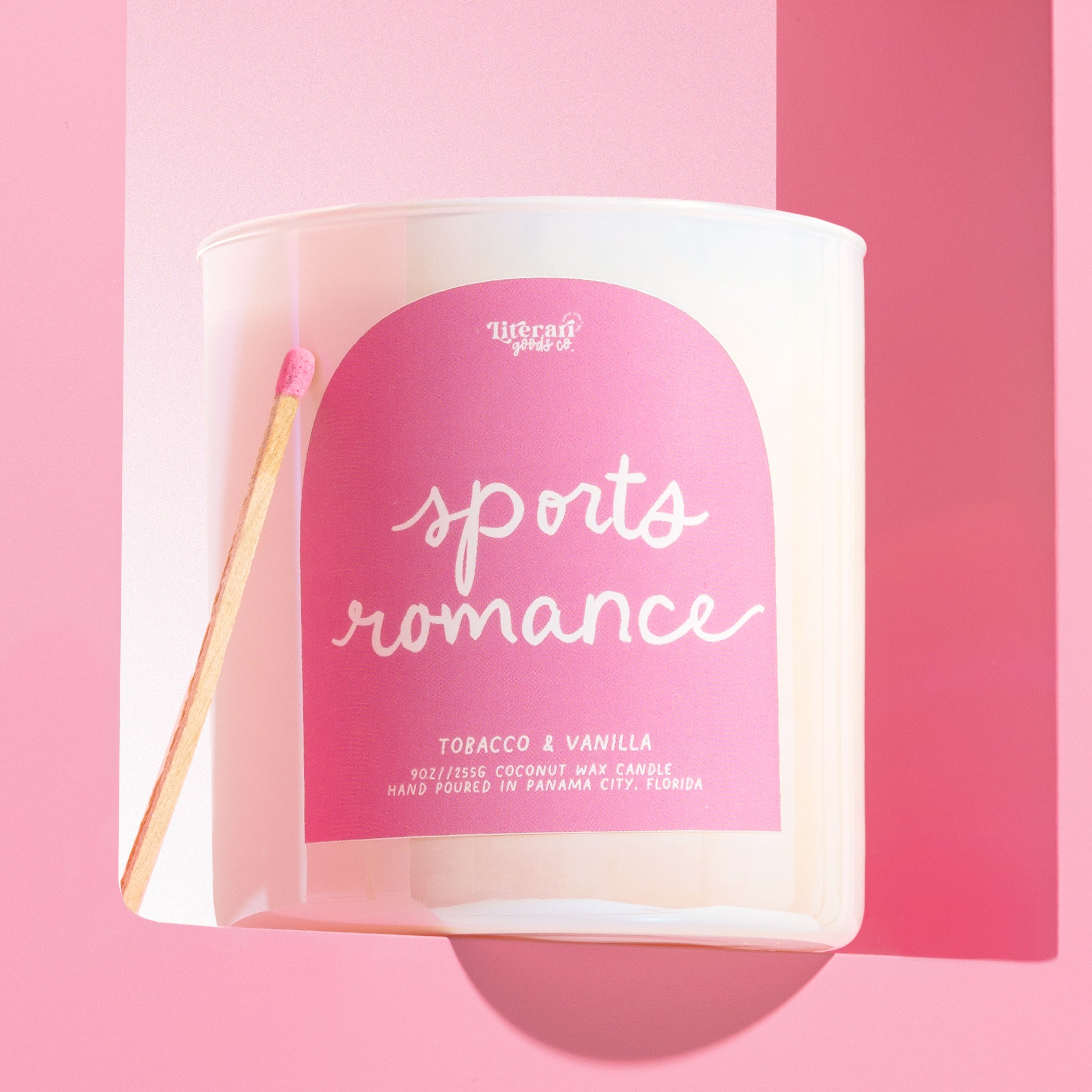 Book themed Candle with 'sports romance' label on a pink background